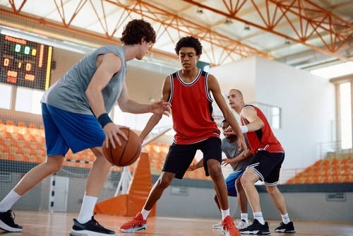 Basketball,Players,In,Action,During,A,Game,At,Indoor,Court.